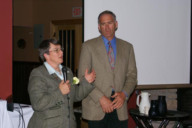 President and Chief of the Rescue Squad Julie Harjung addresses banquet attendees 5/18/2012.  Vice President and Captain Bill Madden looks on.